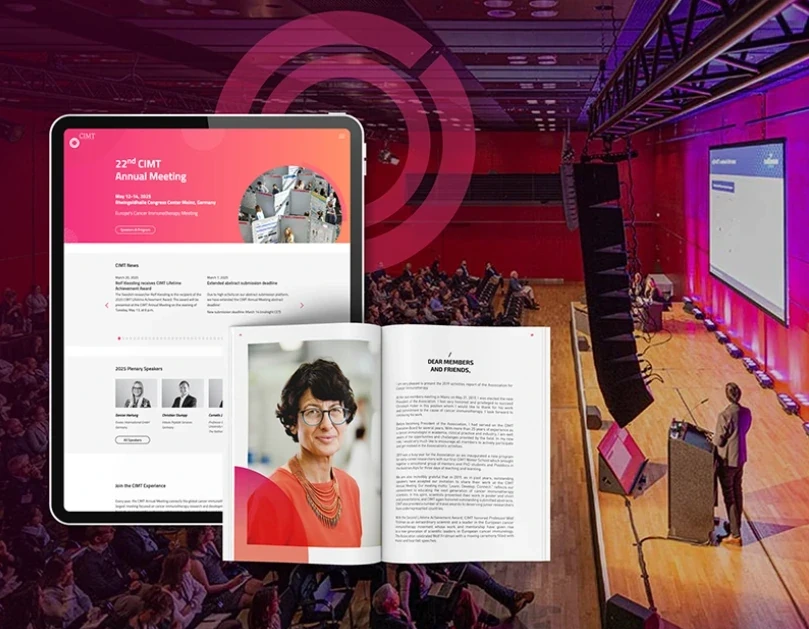 The CIMT annual meeting website on a tablet and the printed programme, in front of a conference hall