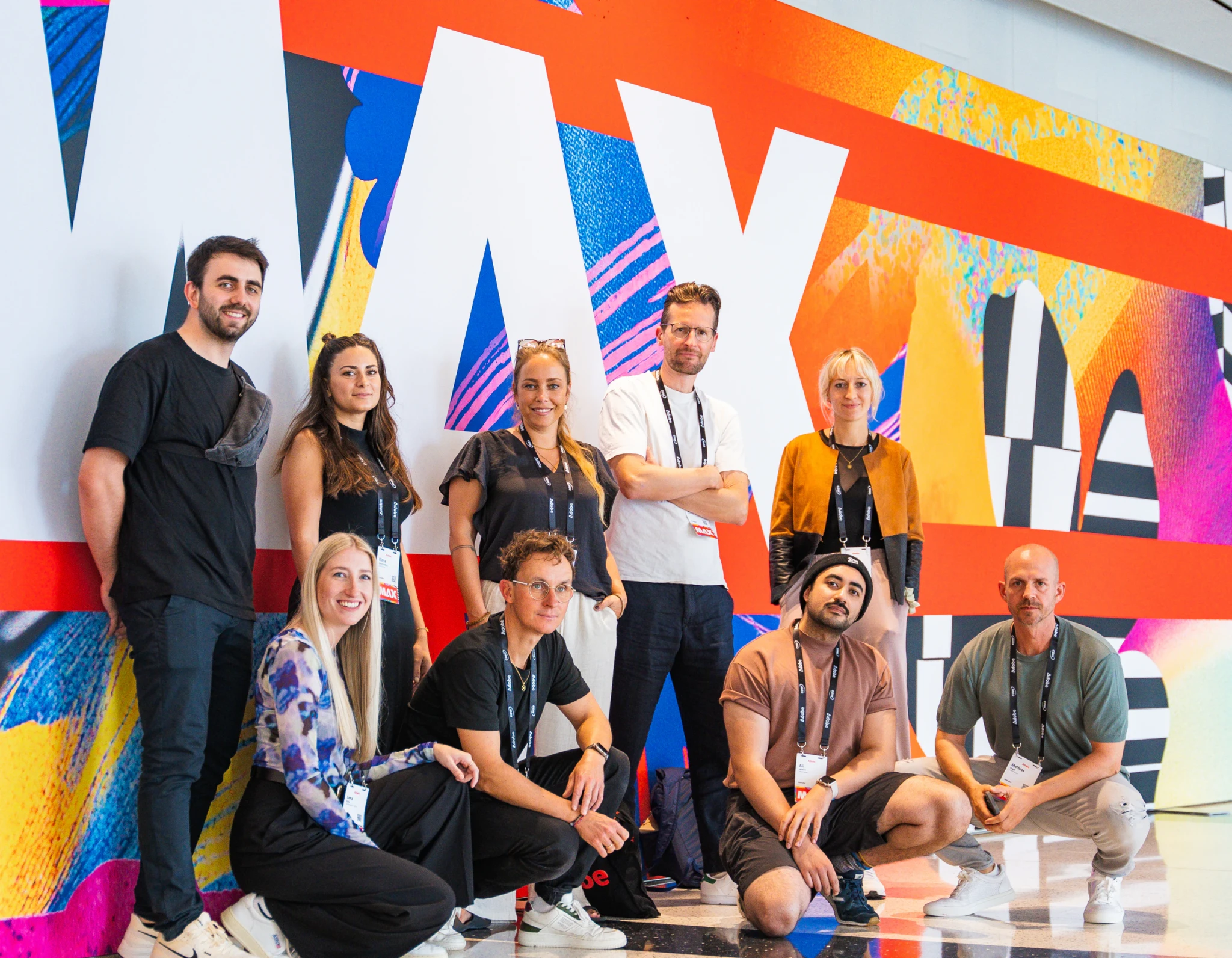 The Lab team in front of a colourful mural