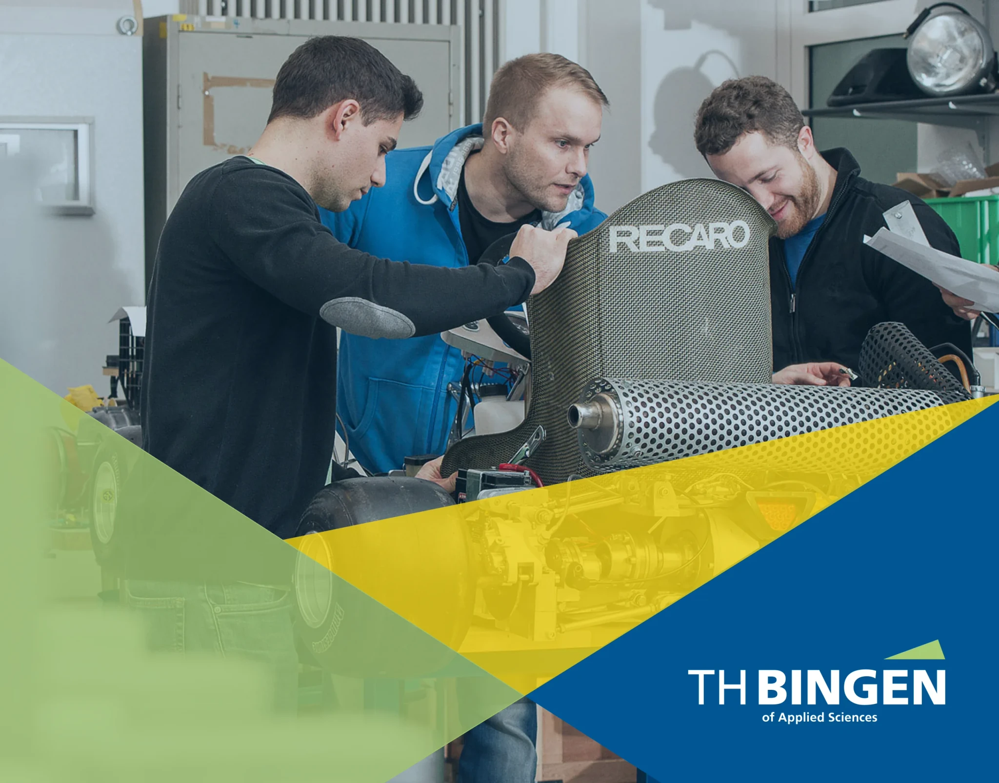 Three students working on a Recaro seat in a workshop, with the TH Bingen logo